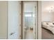 En-suite bathroom features tile flooring and a shower-tub combo at 37903 W San Clemente St, Maricopa, AZ 85138
