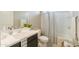 Well-lit bathroom with a vanity, modern sink, and a shower-tub combo at 37903 W San Clemente St, Maricopa, AZ 85138