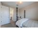 Cozy bedroom with a unique bed frame, a chair, and access to a well-organized walk-in closet at 37903 W San Clemente St, Maricopa, AZ 85138