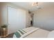 Bedroom featuring a large closet with sliding doors and a neutral color scheme at 37903 W San Clemente St, Maricopa, AZ 85138