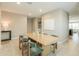 Open concept dining room with tile floors, natural light, and modern decor at 37903 W San Clemente St, Maricopa, AZ 85138