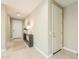 Inviting entryway with tile floors, neutral color scheme, and decorative console table at 37903 W San Clemente St, Maricopa, AZ 85138