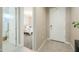Light and bright foyer with tile flooring leading to the bedroom at 37903 W San Clemente St, Maricopa, AZ 85138