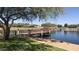 A community lake provides beautiful water views from the pier, enhancing the neighborhood's charm at 37903 W San Clemente St, Maricopa, AZ 85138