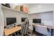 Organized walk-in closet with built-in shelving, creating an ideal workspace with dual monitors at 37903 W San Clemente St, Maricopa, AZ 85138