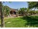 Well-maintained backyard with lush grass and landscaping at 42310 W Fountainhead St, Maricopa, AZ 85138