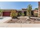 Charming home featuring a beautifully landscaped front yard with desert plants and decorative rock at 42310 W Fountainhead St, Maricopa, AZ 85138