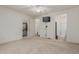 Large main bedroom with neutral carpet features a closet and an attached bathroom with a glass shower at 42310 W Fountainhead St, Maricopa, AZ 85138