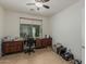 Office area with built-in desk and serene outdoor view at 42310 W Fountainhead St, Maricopa, AZ 85138