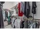 Walk-in closet with shelving and clothing storage at 42310 W Fountainhead St, Maricopa, AZ 85138