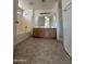 Bathroom featuring double sinks, vanity with mirrors, tub and shower at 43213 W Cowpath Rd, Maricopa, AZ 85138