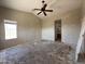 Room with ceiling fan, window and attached bathroom for convenience at 43213 W Cowpath Rd, Maricopa, AZ 85138
