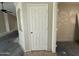 View of entryway, including door and arched wall, showing design and natural light at 43213 W Cowpath Rd, Maricopa, AZ 85138