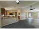 Bright kitchen featuring light wood cabinets, granite countertops and open layout at 43213 W Cowpath Rd, Maricopa, AZ 85138