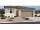 Charming single-story home with a two-car garage and low maintenance desert landscaping at 47450 W Kenner Dr, Maricopa, AZ 85139
