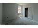 Bedroom with concrete flooring, sliding-door closet and natural light from the bright window at 47706 W Moeller Rd, Maricopa, AZ 85139