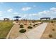 Serene community park with walking paths, green spaces, and a playground for residents to enjoy at 47706 W Moeller Rd, Maricopa, AZ 85139