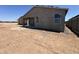 Backyard view of a single-Gathering home featuring a patio and large windows at 47706 W Moeller Rd, Maricopa, AZ 85139
