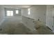 Spacious living room with white walls, concrete floors, great natural light, and great views at 47706 W Moeller Rd, Maricopa, AZ 85139