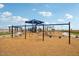 Fun community playground with swings, slides, and climbing structures for children at 47706 W Moeller Rd, Maricopa, AZ 85139