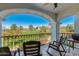 Relax on this balcony with golf course views and wrought iron railings framed by a white archway at 6138 N 28Th St, Phoenix, AZ 85016