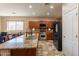 Kitchen features granite countertops, stainless steel appliances, and tile floors at 7169 S Dodane Ct, Gilbert, AZ 85298