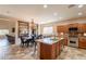 Kitchen area featuring granite countertops, stainless steel appliances, with dining in view at 7169 S Dodane Ct, Gilbert, AZ 85298