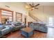 Spacious living room with high ceilings and a decorative ceiling fan at 7169 S Dodane Ct, Gilbert, AZ 85298