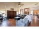 Open-concept living room with hardwood floors and large windows at 7169 S Dodane Ct, Gilbert, AZ 85298