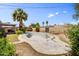 Spacious backyard featuring pool, mature palm trees, covered patio, and a block wall at 7424 E Cambridge Ave, Scottsdale, AZ 85257