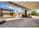 Relaxing backyard featuring a covered patio, a gazebo, mature landscaping, and privacy fence at 7424 E Cambridge Ave, Scottsdale, AZ 85257