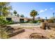Expansive backyard with pool area, planting beds, mature landscaping, and outdoor living area at 7424 E Cambridge Ave, Scottsdale, AZ 85257
