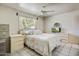 Bedroom featuring tile flooring, a ceiling fan, and neutral decor at 7424 E Cambridge Ave, Scottsdale, AZ 85257