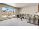 Cozy living room featuring a large window, neutral carpet, and comfortable seating at 7424 E Cambridge Ave, Scottsdale, AZ 85257
