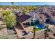 Stunning aerial view of the home with a private courtyard, terracotta roof, and desert landscaping at 8950 E Greenview Dr, Gold Canyon, AZ 85118