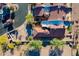 Aerial view of desert property with a red tile roof, beautiful landscaping, and community features at 8950 E Greenview Dr, Gold Canyon, AZ 85118