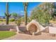 Outdoor brick oven/fireplace with brick flooring, turf lawn, and mountain views at 8950 E Greenview Dr, Gold Canyon, AZ 85118