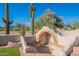 Backyard featuring an outdoor fireplace and seating at 8950 E Greenview Dr, Gold Canyon, AZ 85118