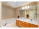 Bathroom with double sink vanity and tub at 8950 E Greenview Dr, Gold Canyon, AZ 85118