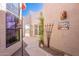 Charming courtyard with garden, art and walkway to front door at 8950 E Greenview Dr, Gold Canyon, AZ 85118