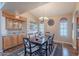 Beautiful dining room featuring hardwood floors, wet bar, and chandelier at 8950 E Greenview Dr, Gold Canyon, AZ 85118
