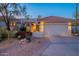Charming desert home with a red tile roof, well-maintained landscaping, and a warm, inviting ambiance at 8950 E Greenview Dr, Gold Canyon, AZ 85118
