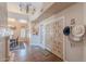 Elegant foyer with decorative lighting, hardwood floors and front door at 8950 E Greenview Dr, Gold Canyon, AZ 85118