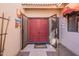 Welcoming double front doors, sidelight windows, and covered entry at 8950 E Greenview Dr, Gold Canyon, AZ 85118