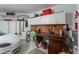 Garage featuring a workbench and a white car at 8950 E Greenview Dr, Gold Canyon, AZ 85118