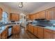 Spacious kitchen featuring hardwood floors, wood cabinetry, and breakfast nook at 8950 E Greenview Dr, Gold Canyon, AZ 85118