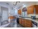 Kitchen with hardwood floors, wood cabinetry, arched window and breakfast nook at 8950 E Greenview Dr, Gold Canyon, AZ 85118