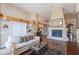 Inviting living room with a fireplace and a minibar at 8950 E Greenview Dr, Gold Canyon, AZ 85118