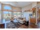 Comfortable living room with beamed ceilings, modern furniture, and scenic views at 8950 E Greenview Dr, Gold Canyon, AZ 85118