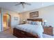 Comfortable main bedroom featuring a king bed, ensuite bathroom, and stylish decor at 8950 E Greenview Dr, Gold Canyon, AZ 85118